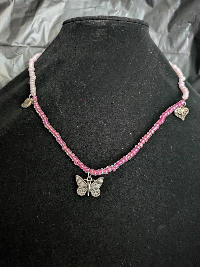 Pink bead and butterfly necklace