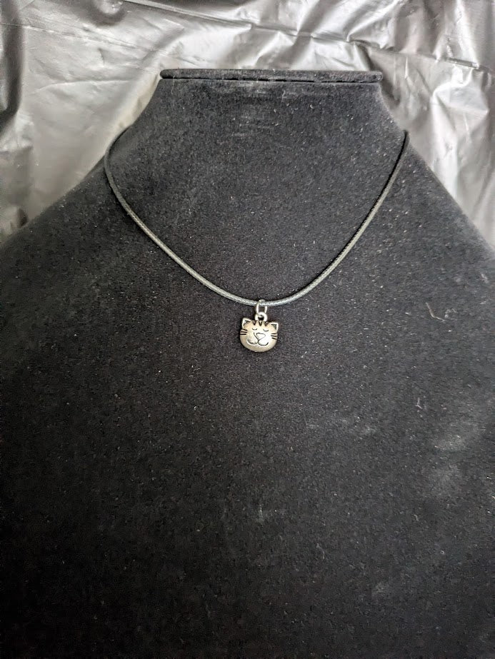 Black corded necklace with cat face