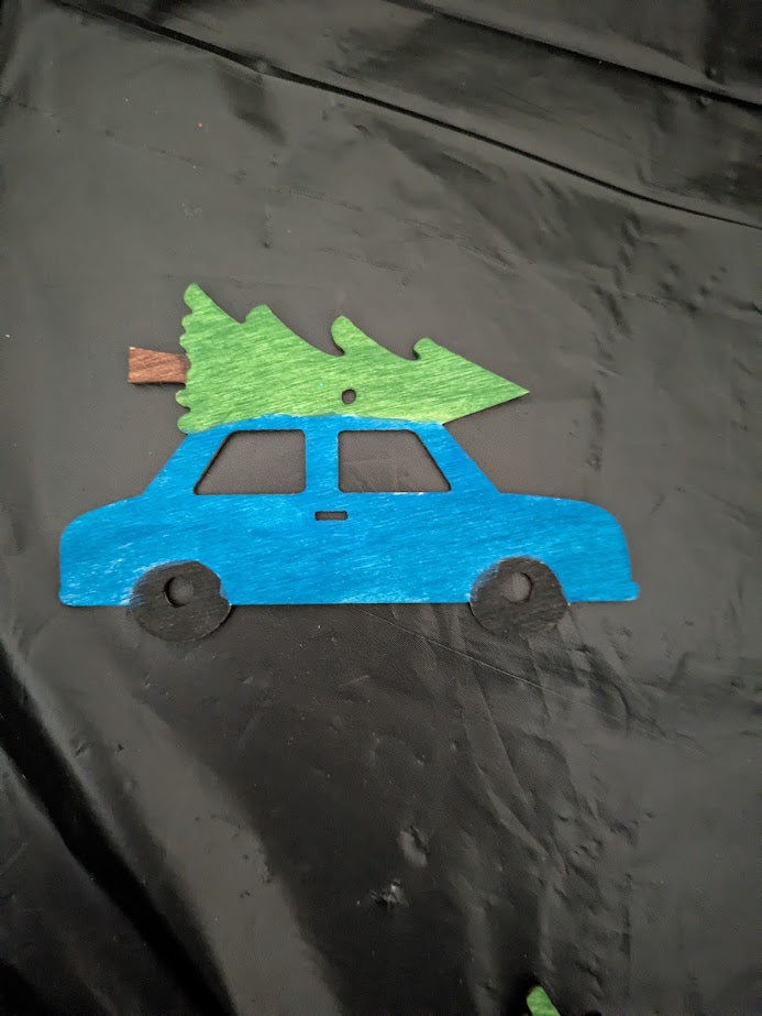 Blue Car with Christmas Tree